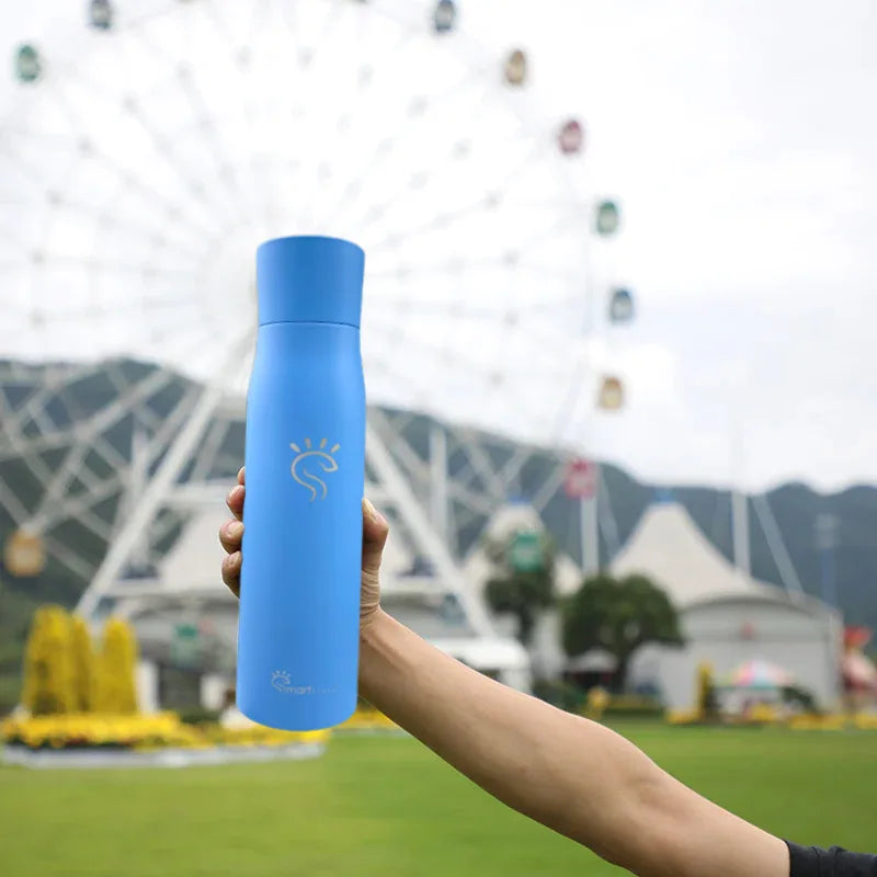 Bright blue smart UV bottle in hand