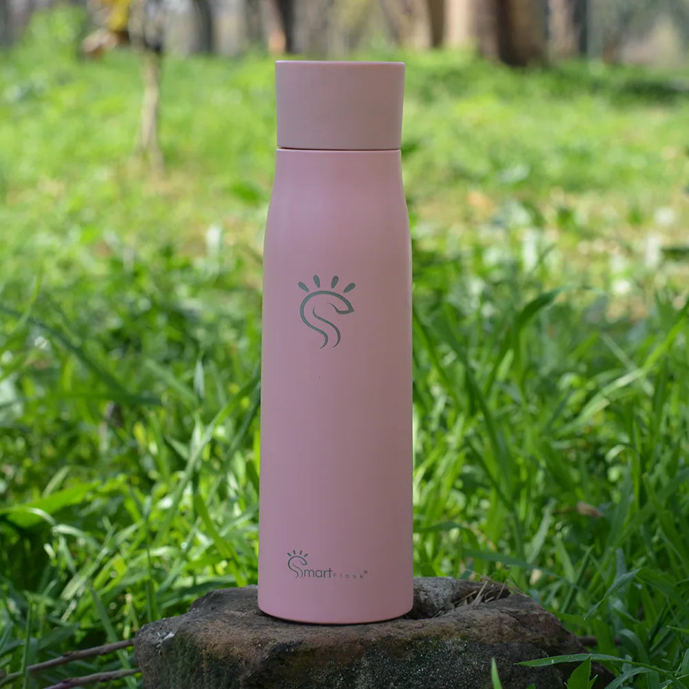 Rose pink smart UV-C sterilizer bottle on the ground
