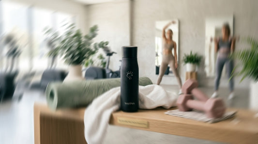 Premium SmartFlask stainless steel water bottle for women in a modern Australian wellness studio